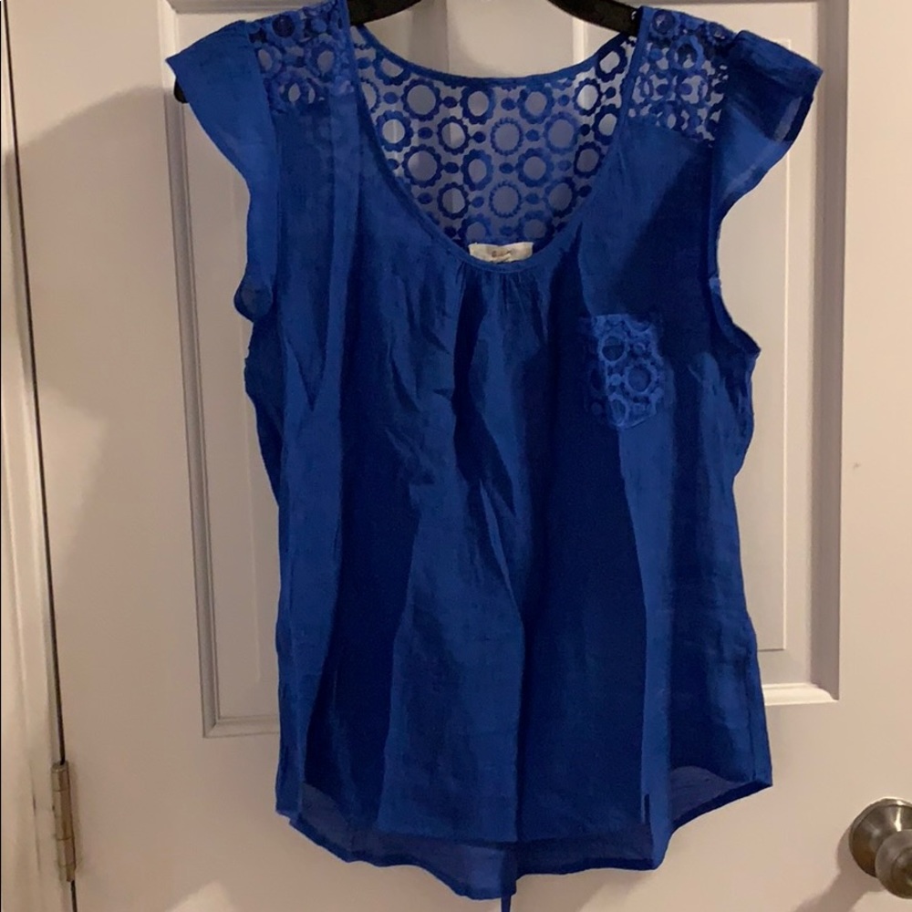 Blue blouse. Ties in back.